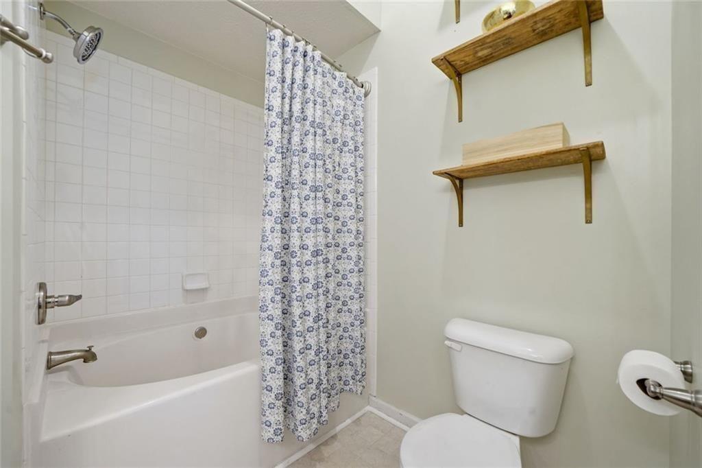 148 Timber Gate Drive Lawrenceville, GA 30045 - Photo 19 of 38 a white toilet sitting next to a bath tub