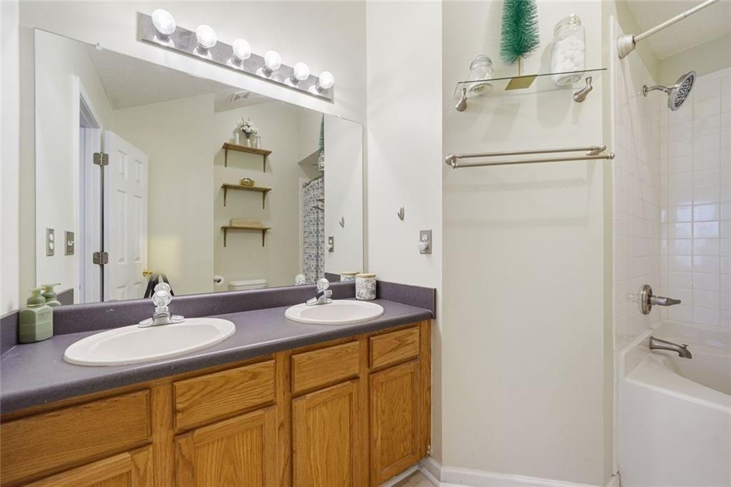 148 Timber Gate Drive Lawrenceville, GA 30045 - Photo 20 of 38 a bathroom with a sink double vanity and a mirror