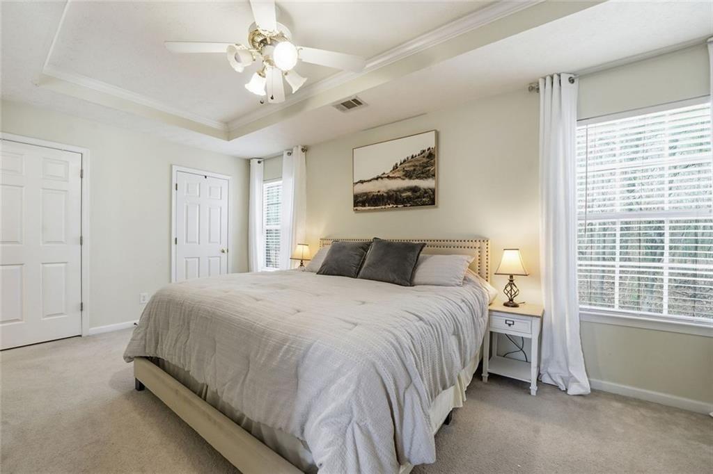 148 Timber Gate Drive Lawrenceville, GA 30045 - Photo 25 of 38 a spacious bedroom with a bed and a window