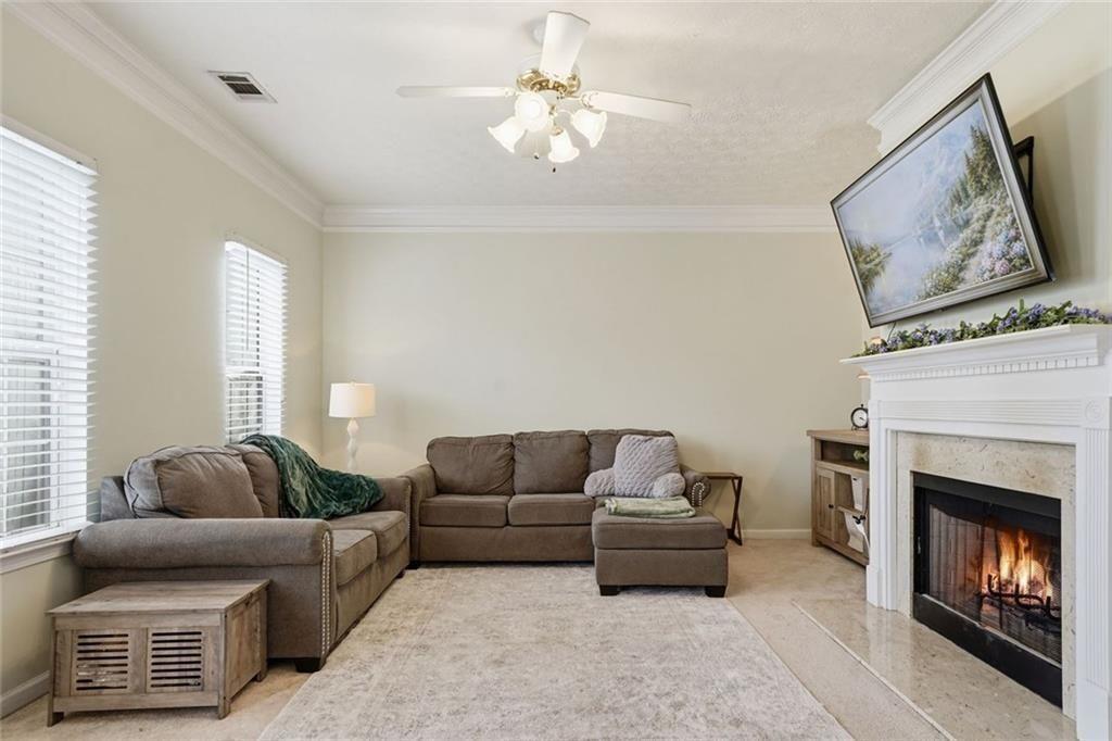 148 Timber Gate Drive Lawrenceville, GA 30045 - Photo 6 of 38 a living room with furniture and a fireplace
