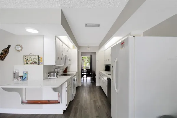 a view of living room with furniture and flat screen tv