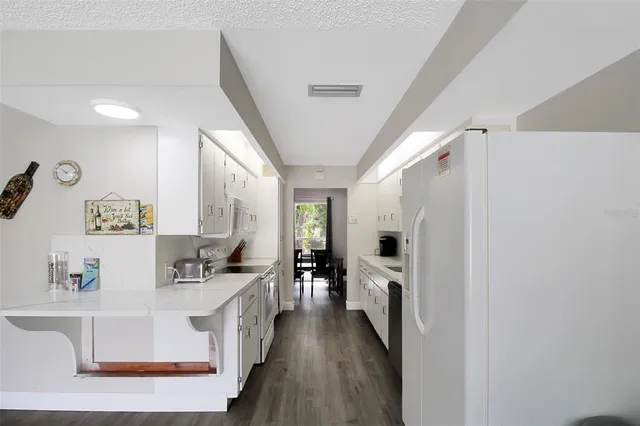 a view of living room with furniture and flat screen tv