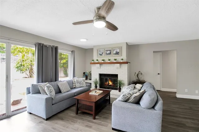 a living room with furniture and a fireplace