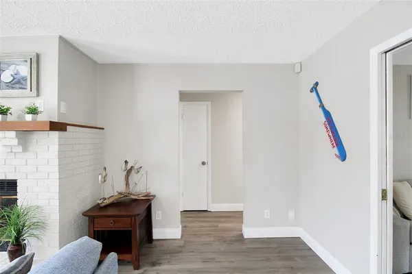 a view of a livingroom with furniture and wooden floor