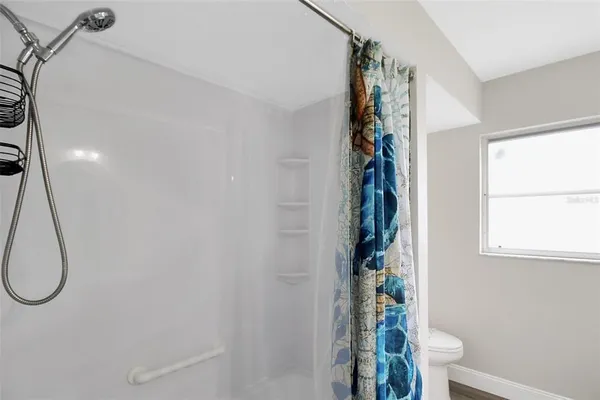a view of a bathroom with a shower curtain