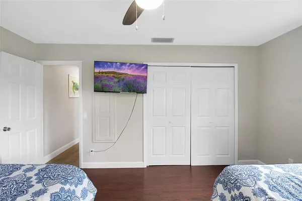 a bedroom with a bed and a dresser