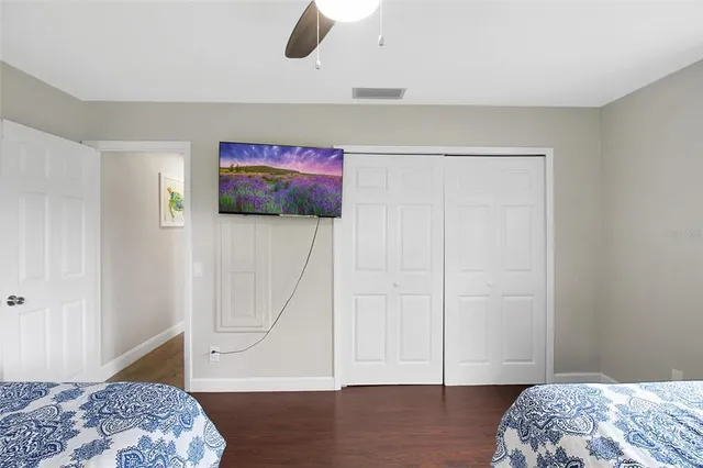 a bedroom with a bed and a dresser