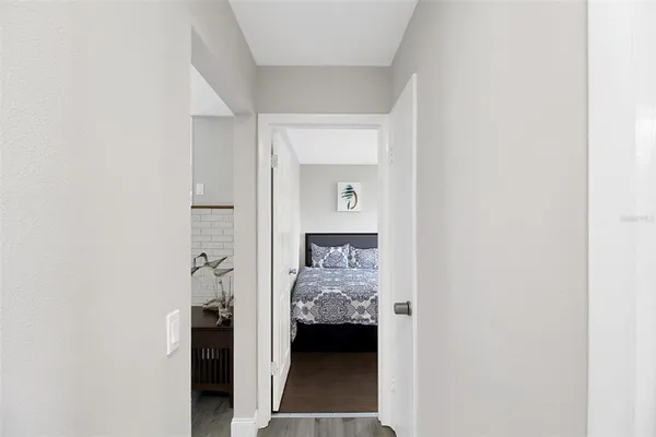 a view of en suite bathroom with a sink and a closet