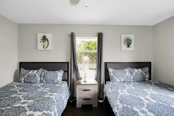 a bedroom with a bed and window