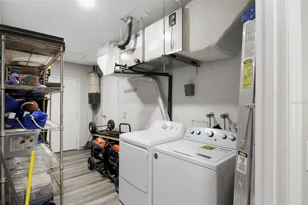a view of storage and utility room with washer and dryer