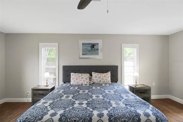 a bedroom with a bed and window