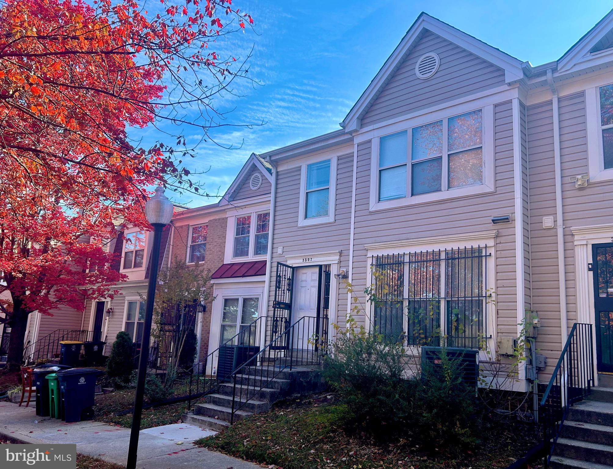 a view of a brick house with many windows