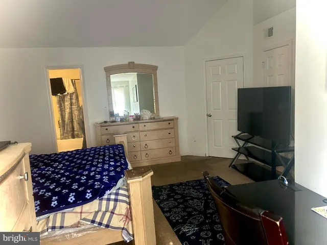 a kitchen with a sink a stove and a microwave