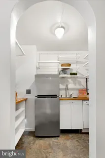 a kitchen with stainless steel appliances granite countertop a stove and a refrigerator