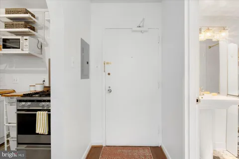 a kitchen with stainless steel appliances a refrigerator and cabinets