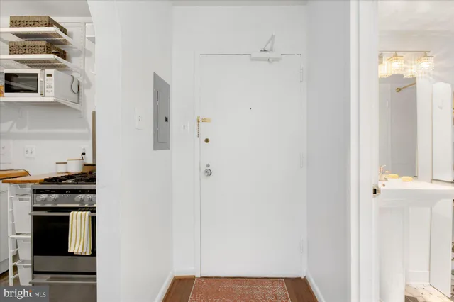 a kitchen with stainless steel appliances a refrigerator and cabinets