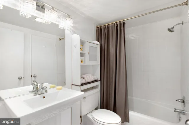 a view of a kitchen from the hallway