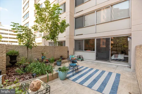 a front view of a house with chairs