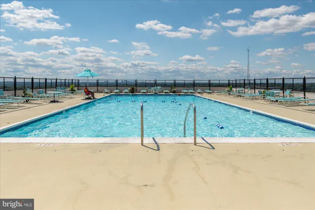 a living room with furniture and a mirror
