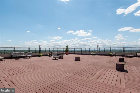 a reading room with furniture and a book shelf