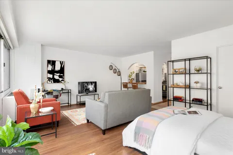 a picture of a room with a white wall and a picture