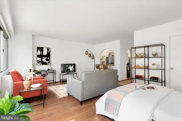 a picture of a room with a white wall and a picture