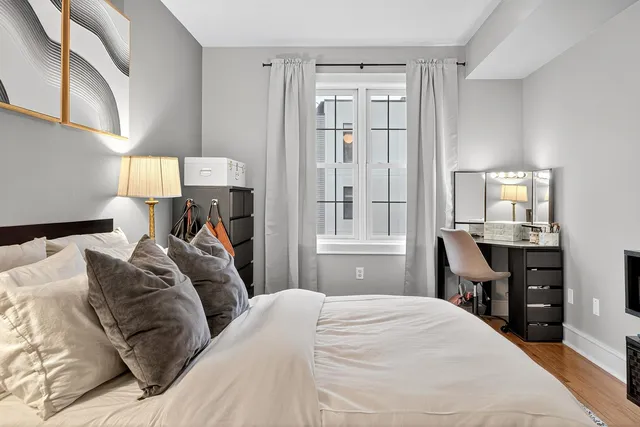 a bed room with a bed and a window