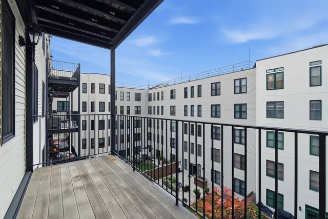 a view of a balcony with wooden floor