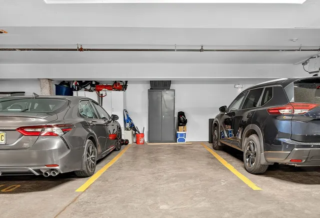a view of parking garage with cars