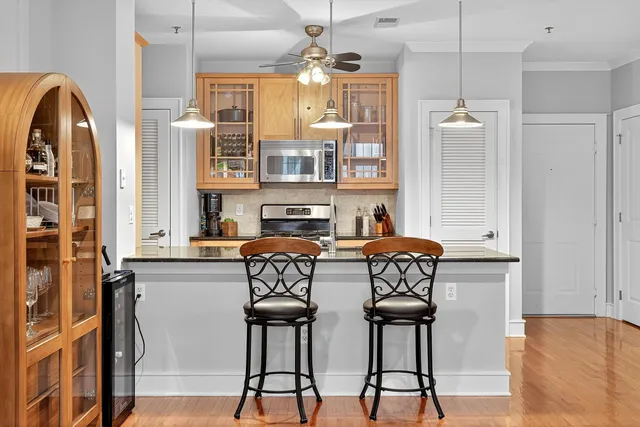 a view of a livingroom with furniture and windows