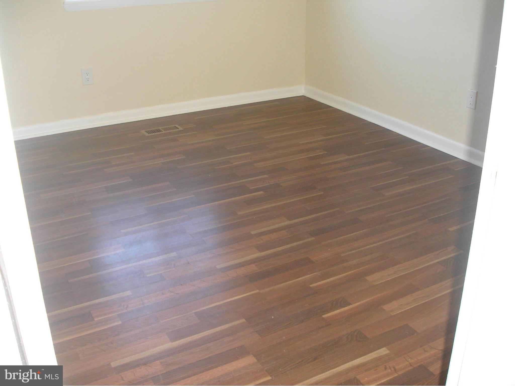 4705 Sargent Road Northeast Washington, DC 20017 - Photo 11 of 24 a view of an empty room with wooden floor