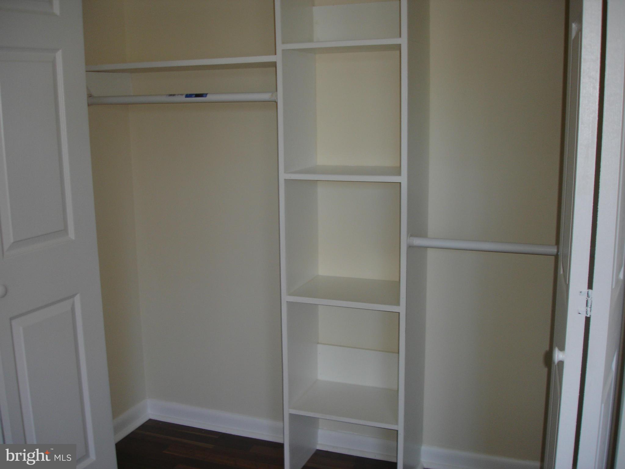 4705 Sargent Road Northeast Washington, DC 20017 - Photo 13 of 24 a view of walk in closet with empty racks