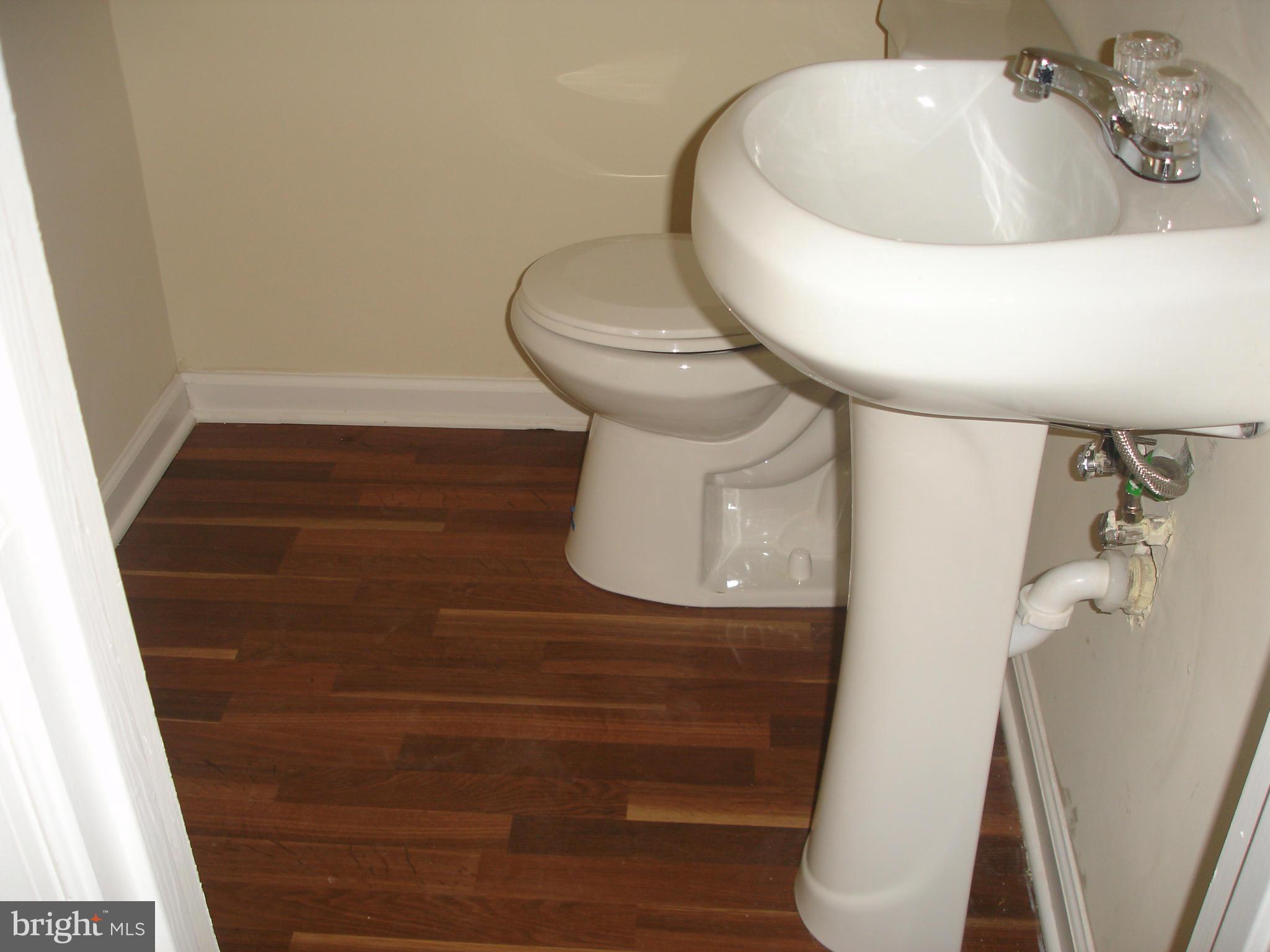4705 Sargent Road Northeast Washington, DC 20017 - Photo 19 of 24 a bathroom with a sink and toilet
