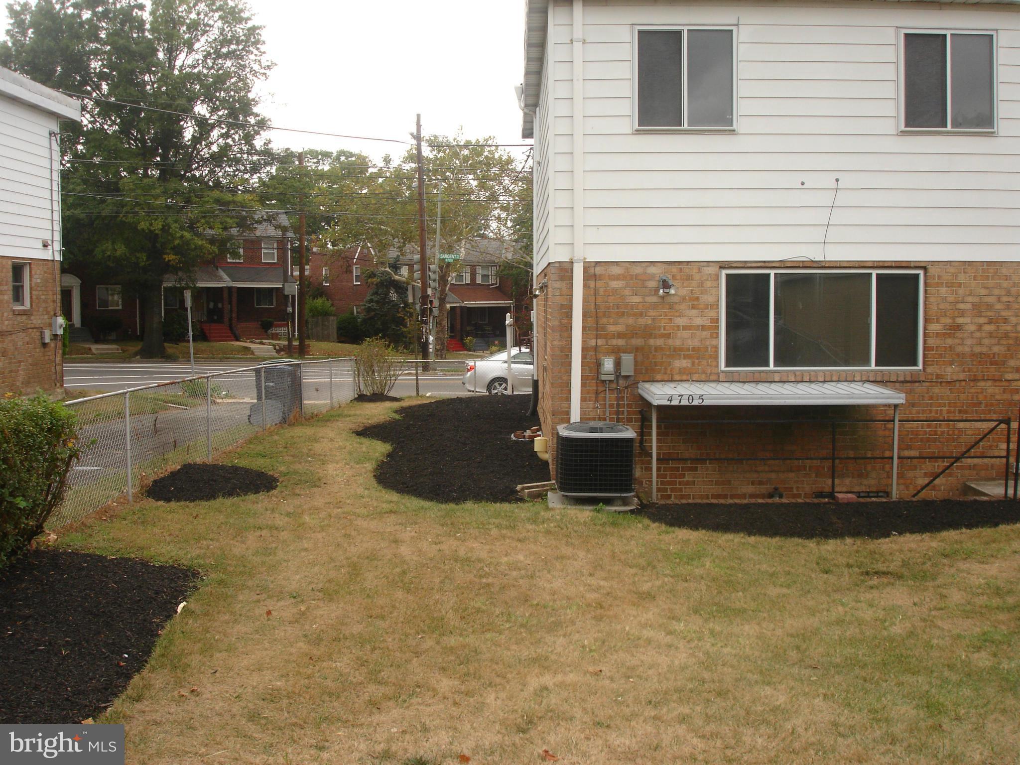 4705 Sargent Road Northeast Washington, DC 20017 - Photo 24 of 24 a view of a house with backyard and sitting area