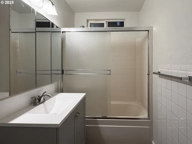 a bathroom with a sink and mirror