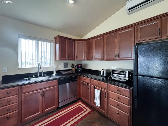 a view of a dining room with furniture and a livingroom