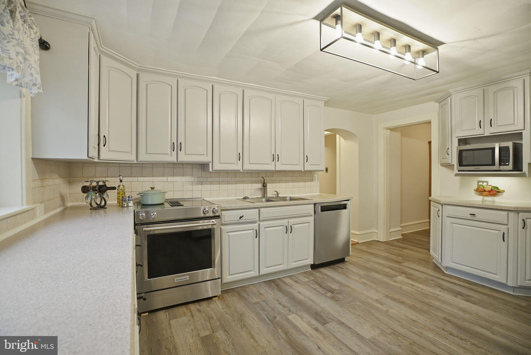 330 Fairhill Road Hatfield, PA 19440 - Photo 11 of 49 a kitchen with stainless steel appliances granite countertop a stove sink and cabinets