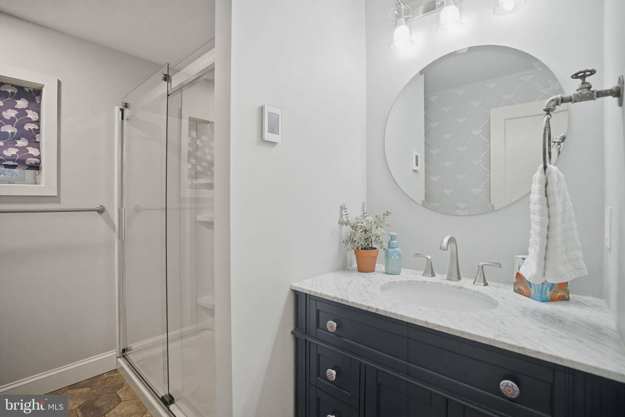 330 Fairhill Road Hatfield, PA 19440 - Photo 29 of 49 a bathroom with a granite countertop sink a mirror and shower