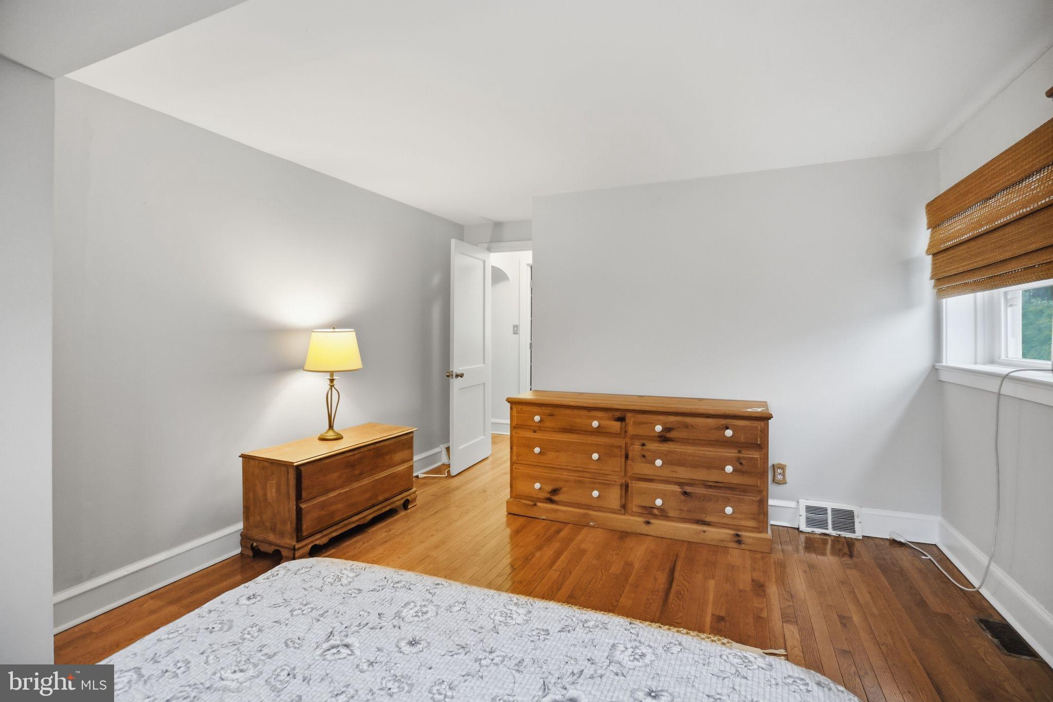 330 Fairhill Road Hatfield, PA 19440 - Photo 31 of 49 a bedroom with a bed and dresser with mirror