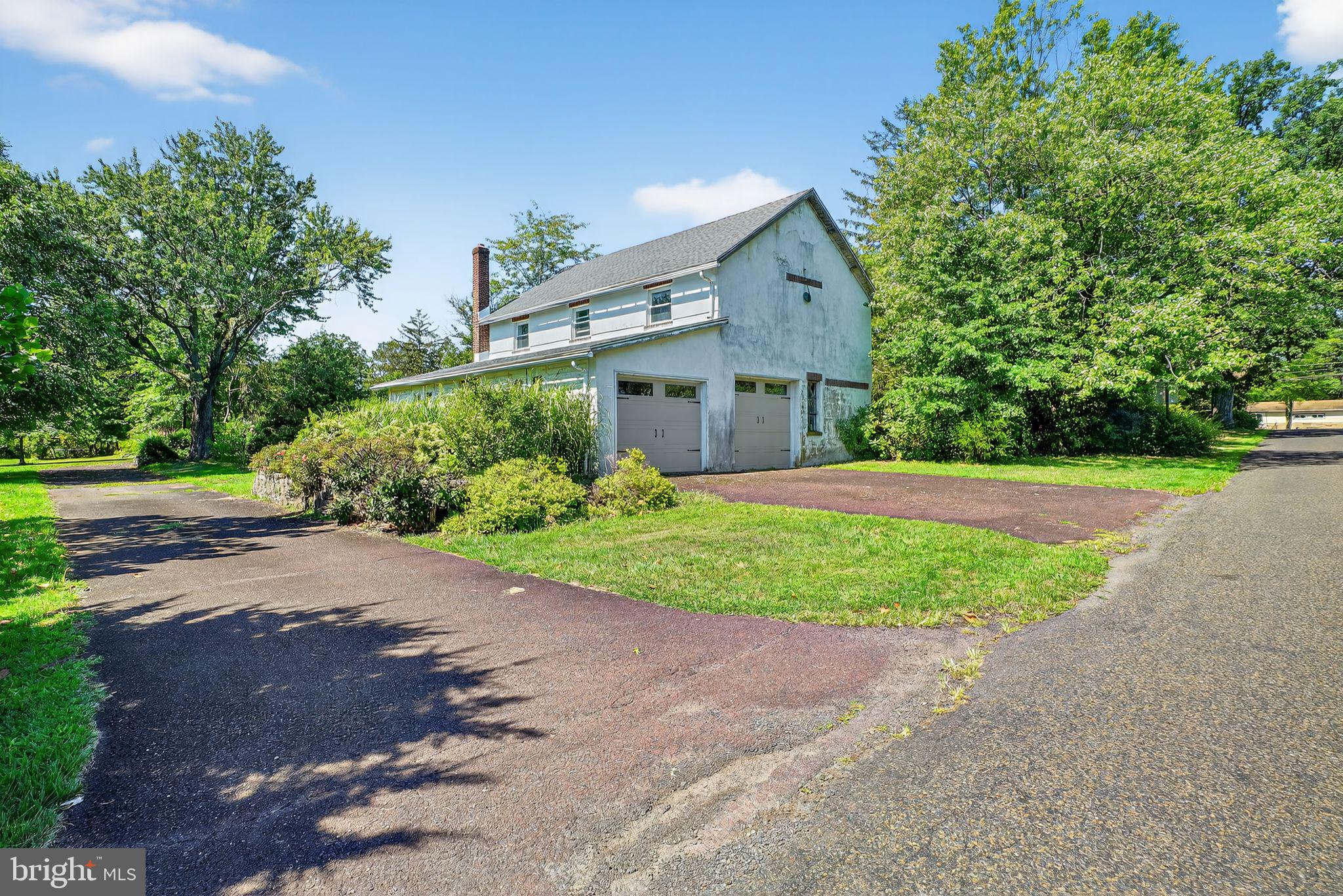 330 Fairhill Road Hatfield, PA 19440 - Photo 38 of 49 a front view of a house with a yard and a garage