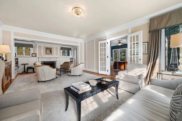 a view of a dining room with furniture wooden floor and chandelier