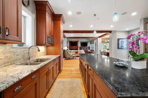 a bathroom with a sink toilet and mirror