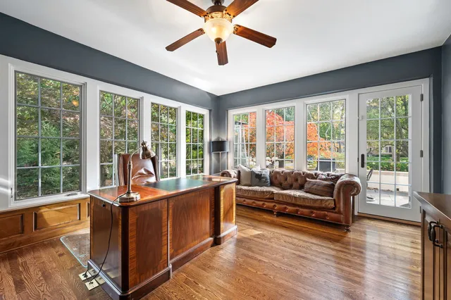 an aerial view of a house with a yard and garden