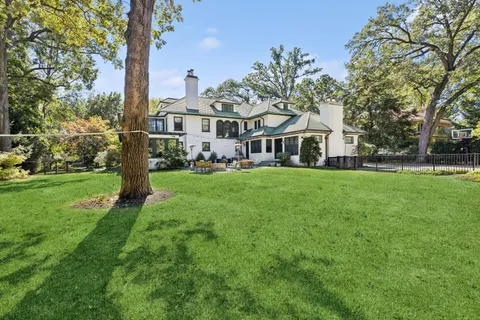 a view of a patio with a table and chairs