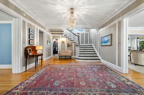 a kitchen with stainless steel appliances granite countertop a sink counter space cabinets and a large window