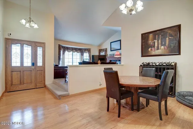a view of a patio with chairs and plants