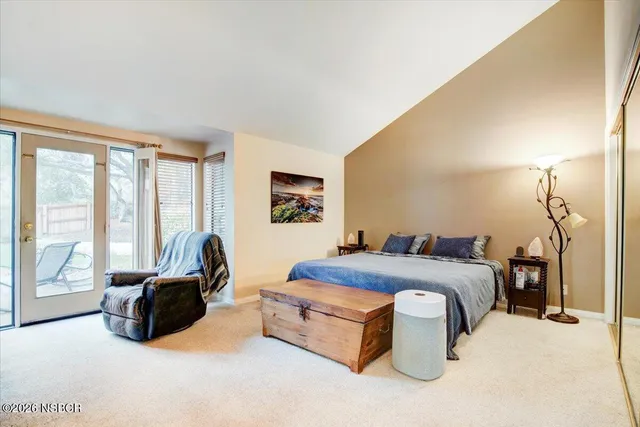 a view of a livingroom with furniture and a flat screen tv