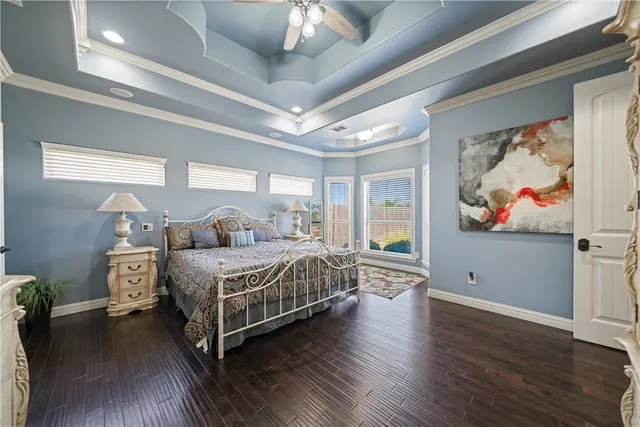 a kitchen with granite countertop a sink stove and refrigerator