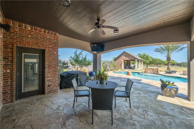 a view of swimming pool with a yard