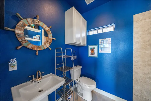 a building outdoor space with patio furniture and potted plants